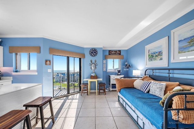 bedroom featuring baseboards, access to exterior, light tile patterned floors, and ornamental molding