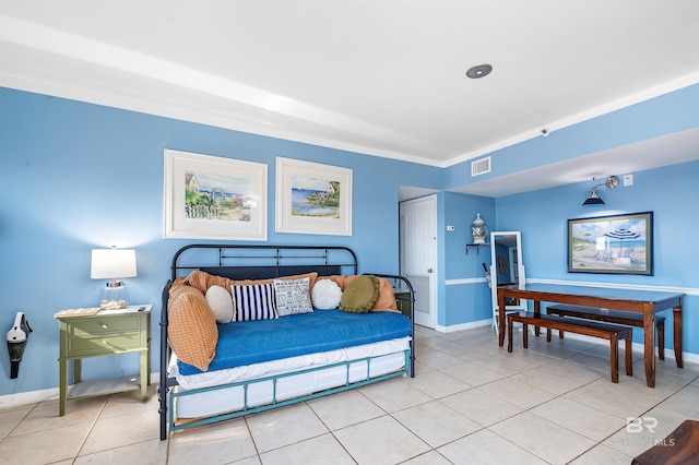 bedroom with baseboards, visible vents, and light tile patterned floors