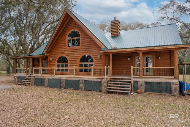 log cabin featuring a porch