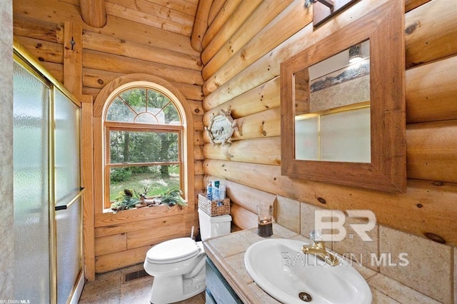 bathroom with vanity, rustic walls, tile floors, wooden ceiling, and toilet