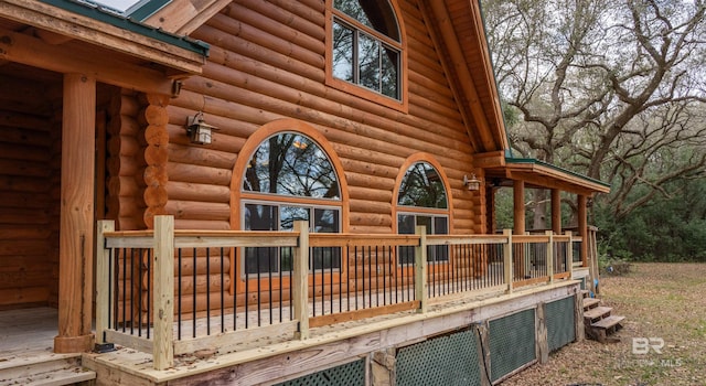 view of home's exterior with a wooden deck