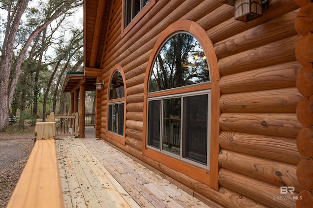 view of side of property with a wooden deck
