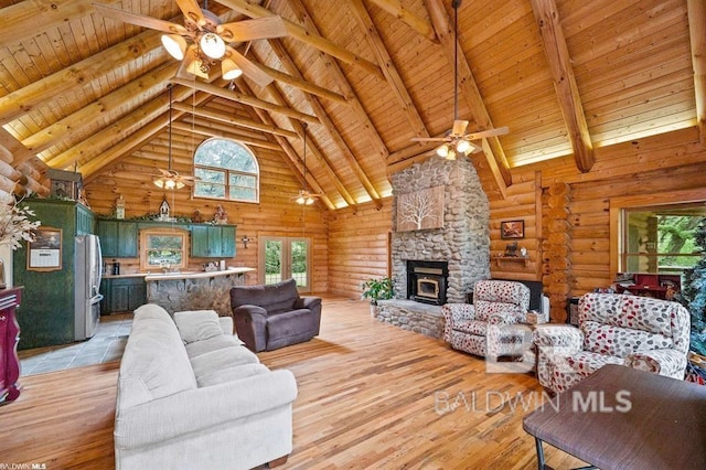 living room with high vaulted ceiling, light wood-type flooring, plenty of natural light, and wood ceiling