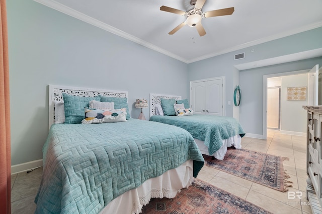 bedroom with light tile patterned flooring, ceiling fan, ornamental molding, and a closet