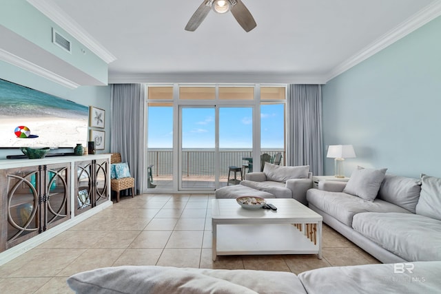 living room with crown molding, ceiling fan, and light tile patterned flooring