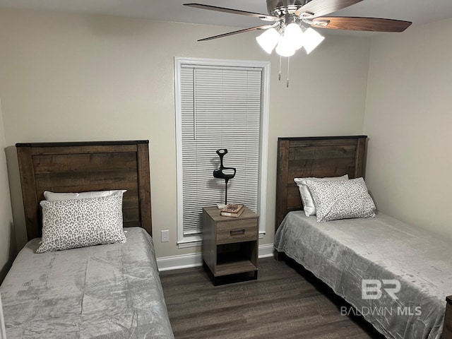 bedroom with dark wood-type flooring and ceiling fan