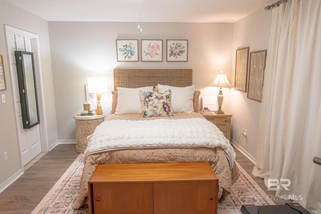 9362 Villas Dr, Foley, AL 36535 - bedroom with baseboards and wood finished floors
