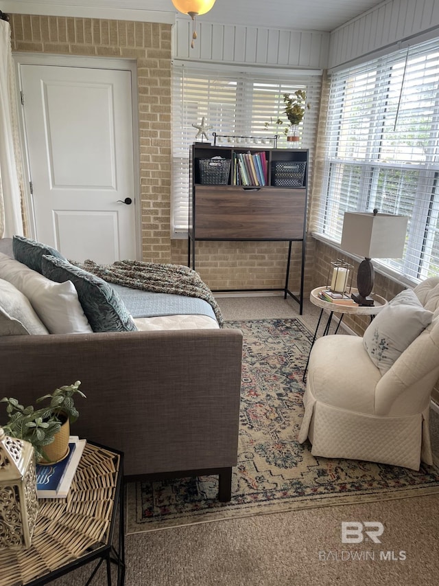 9362 Villas Dr, Foley, AL 36535 - living area featuring carpet floors and brick wall