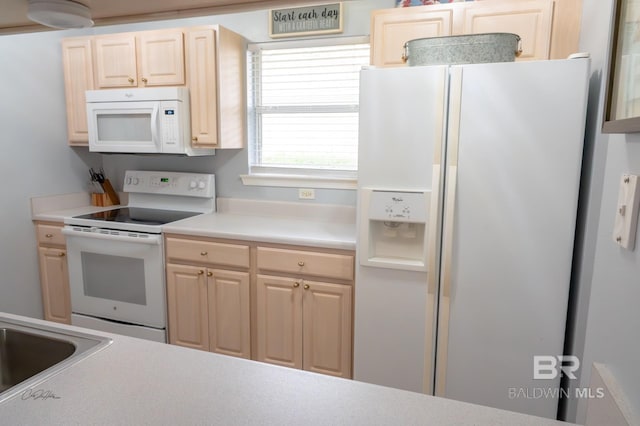 9362 Villas Dr, Foley, AL 36535 - kitchen with light countertops, a sink, light brown cabinetry, and white appliances