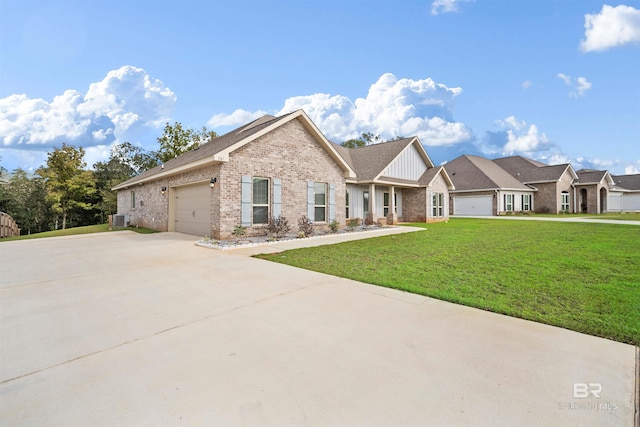 view of front facade with a front lawn, central AC unit, and a garage