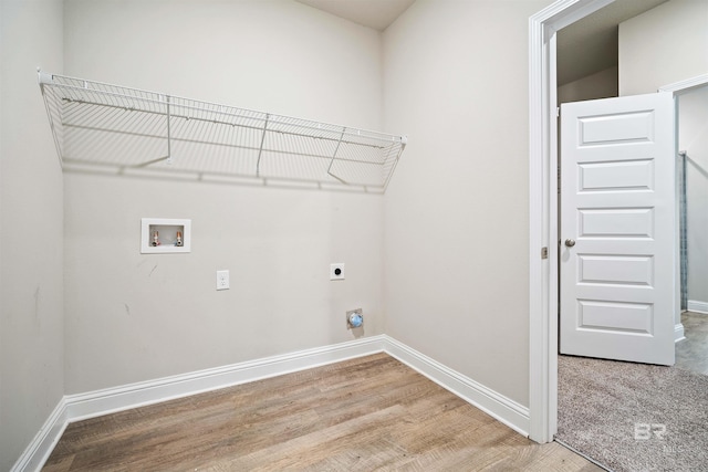 laundry area featuring washer hookup, electric dryer hookup, and hardwood / wood-style floors