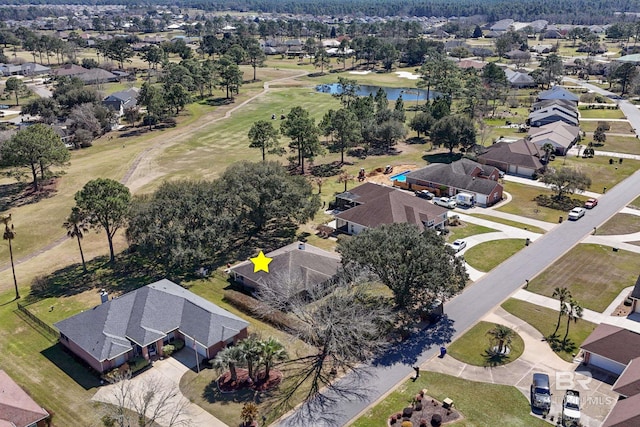 birds eye view of property featuring a water view and a residential view