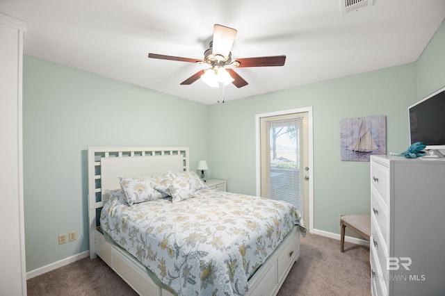 carpeted bedroom with a ceiling fan, visible vents, and baseboards