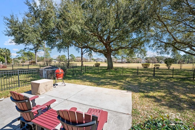 view of patio / terrace with a fenced backyard and a rural view