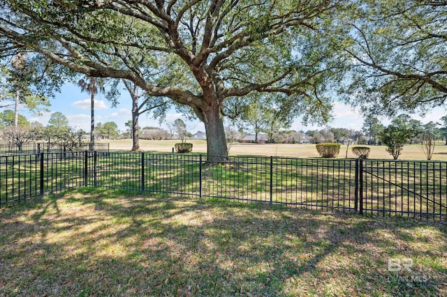 view of yard featuring a rural view and fence