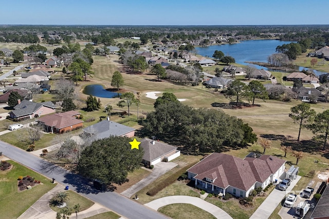 bird's eye view featuring a water view and a residential view