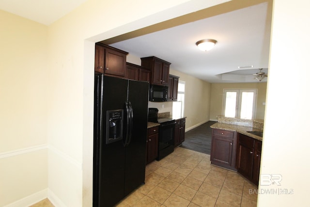 kitchen featuring dark brown cabinets, light tile patterned floors, ceiling fan, and black appliances