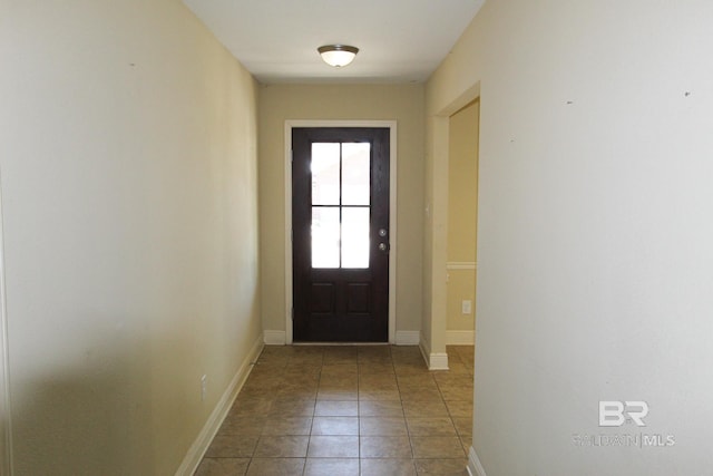 doorway featuring tile patterned flooring