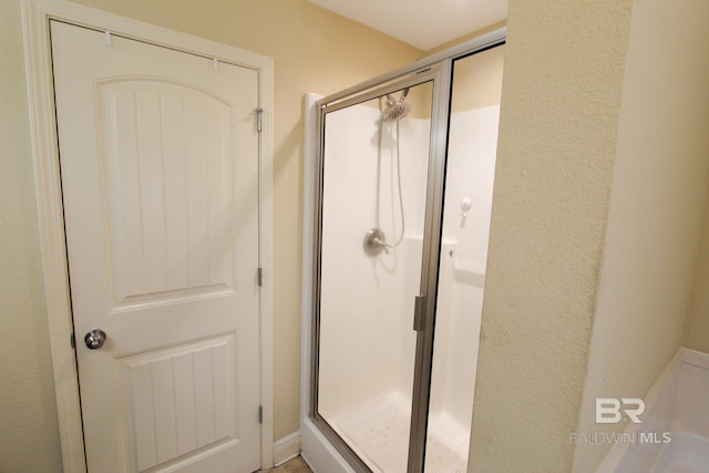 bathroom featuring an enclosed shower