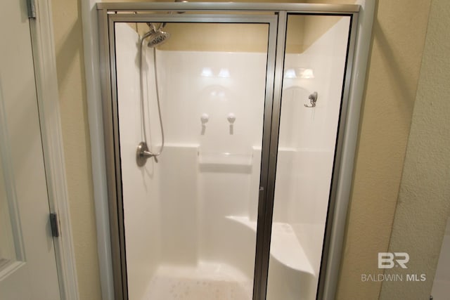 bathroom featuring walk in shower