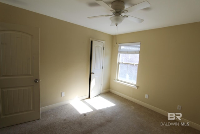 unfurnished bedroom featuring light carpet and ceiling fan