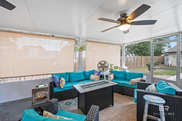 sunroom featuring ceiling fan