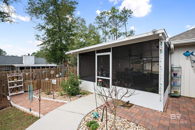 exterior space featuring a sunroom