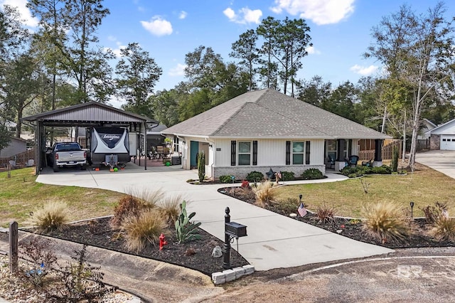 ranch-style home with a front yard and a carport