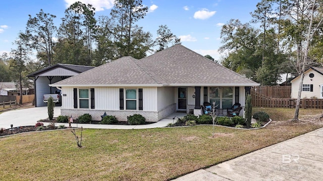 view of front of house featuring covered porch and a front lawn