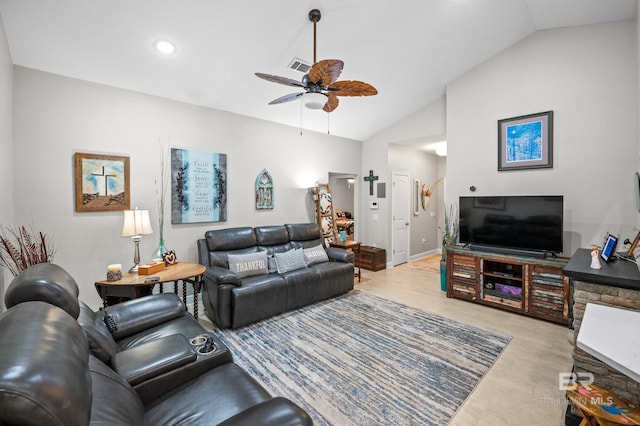 living room with vaulted ceiling, light wood-type flooring, and ceiling fan