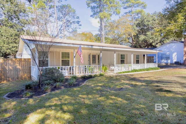 ranch-style house featuring a porch and a front yard