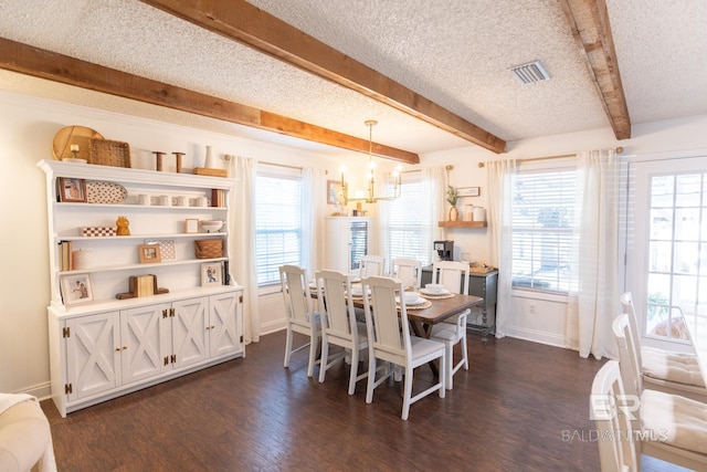 dining room with beamed ceiling, a chandelier, a textured ceiling, and dark hardwood / wood-style flooring