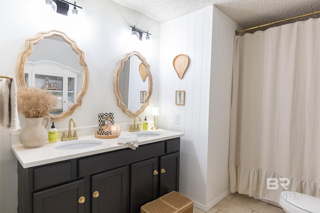 bathroom featuring walk in shower, toilet, a textured ceiling, vanity, and tile patterned flooring