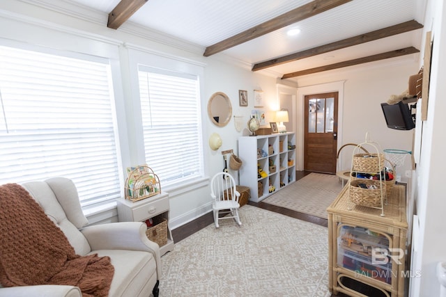 sitting room with beam ceiling and light hardwood / wood-style flooring