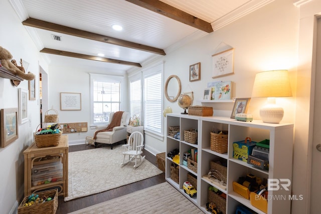 sitting room with beamed ceiling, wood-type flooring, and wood ceiling