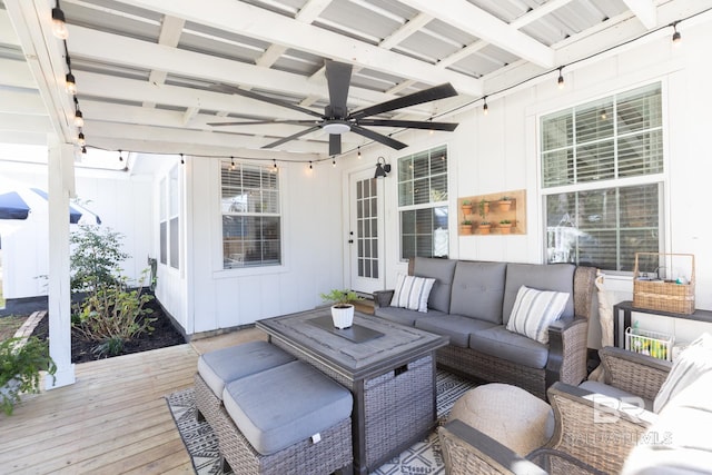 deck featuring ceiling fan and outdoor lounge area