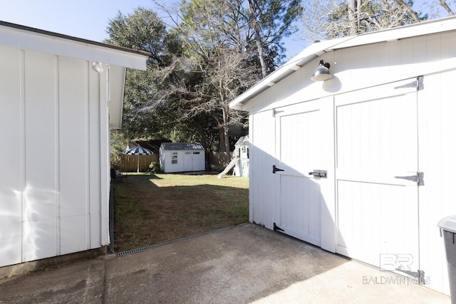 view of outbuilding featuring a playground and a yard