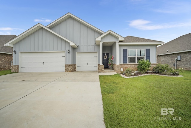 view of front of property with a garage and a front yard