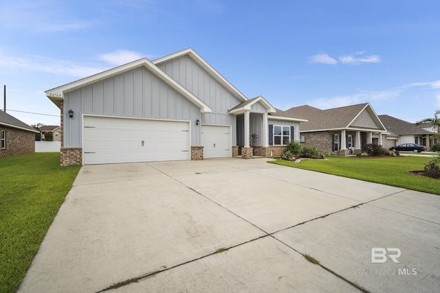 view of front of property featuring a garage and a front lawn