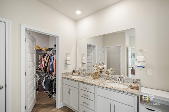 bathroom with hardwood / wood-style flooring and vanity