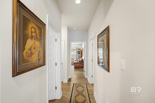 corridor featuring light hardwood / wood-style floors