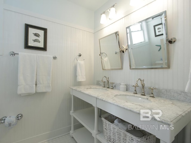 bathroom featuring double vanity and a sink