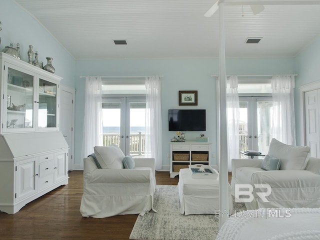 living room with french doors, dark wood-type flooring, and visible vents