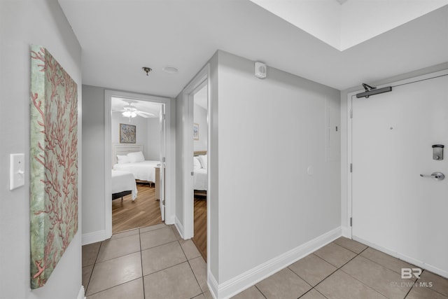 interior space featuring ceiling fan and tile patterned floors