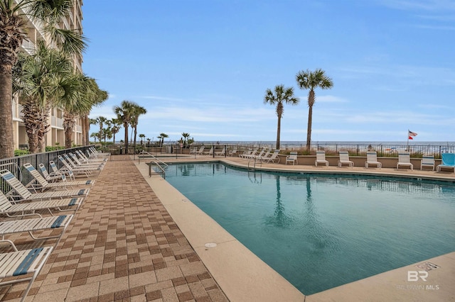 view of swimming pool with a patio