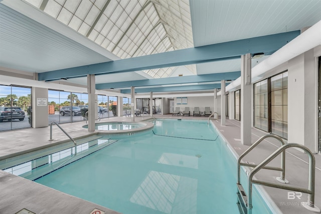 view of swimming pool with a skylight