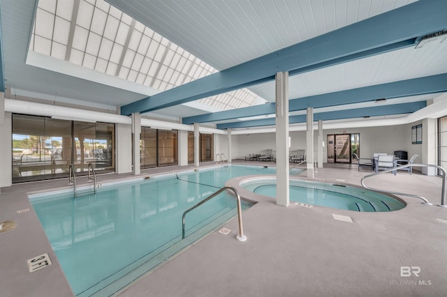 view of swimming pool with a skylight