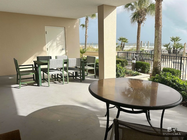 view of patio with a water view
