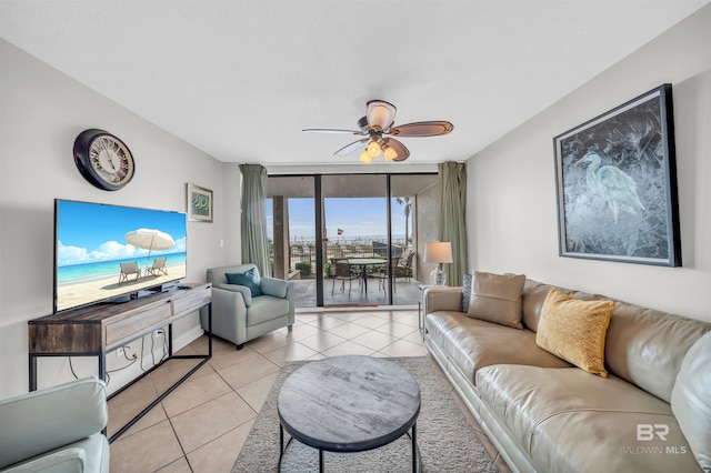 living room featuring light tile patterned flooring and ceiling fan