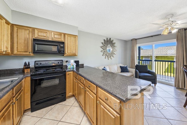 kitchen with light tile patterned floors, open floor plan, a textured ceiling, a peninsula, and black appliances